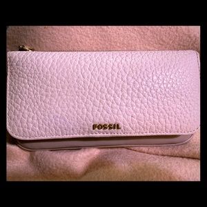 Cream and tan colored fossil wallet